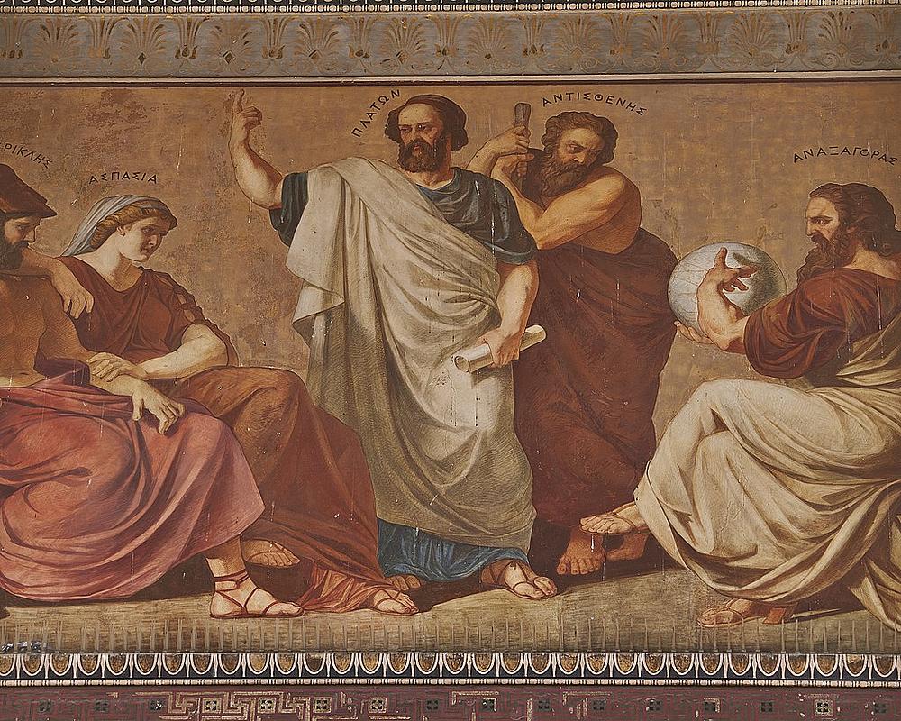 En este mural están representadas las figuras de (de izquierda a derecha)ː Pericles, Aspasia, Platón y Antístenes, y Anaxágoras. Pintado en el siglo XIX por el pintor bávaro Karl Rahl y el polaco Edward Lebiedski (Dominio público)